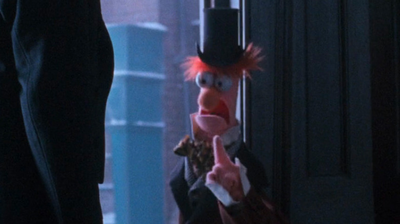 Beaker raising a finger to Scrooge