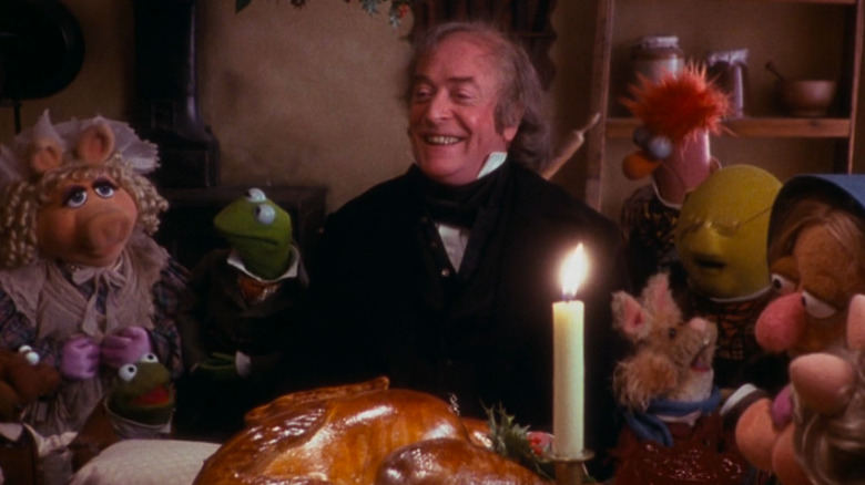 Michael Caine and the Muppet cast of The Muppets Christmas Carol