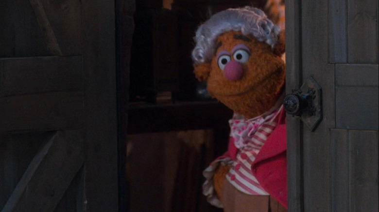 Fozzie as Fozziwig looking out the door of his rubber chicken factory