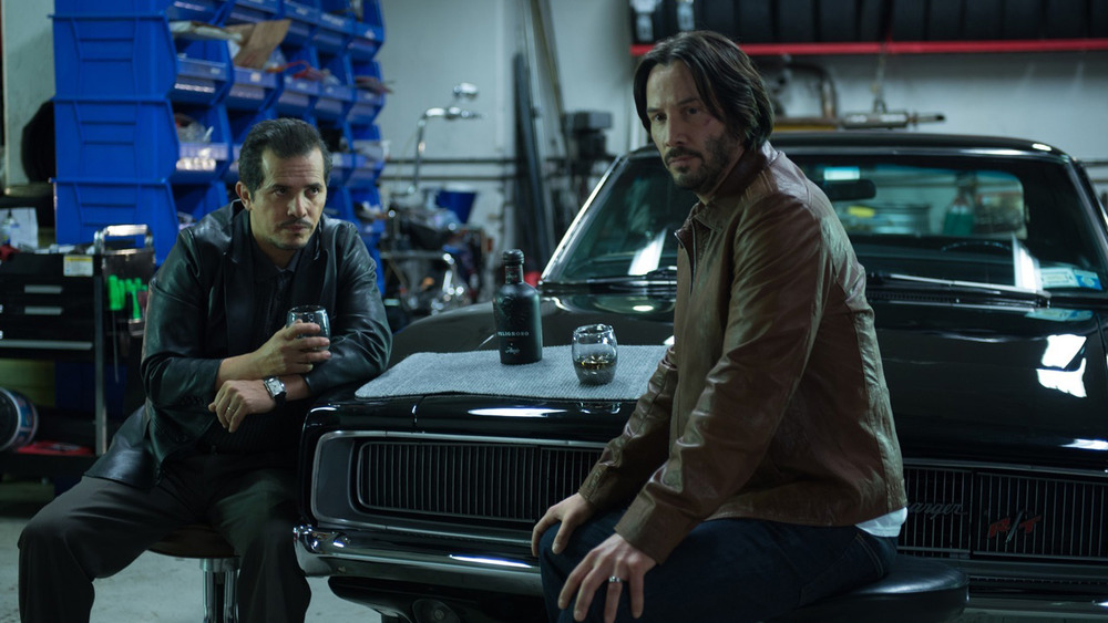 Keanu Reeves as John Wick and John Leguizamo as Aurelio in John Wick