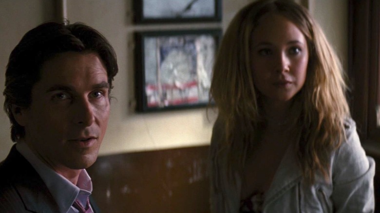 Christian Bale and Juno Temple in The Dark Knight Rises