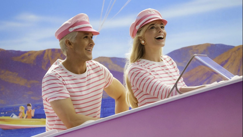 Ken rides in Barbie's boat