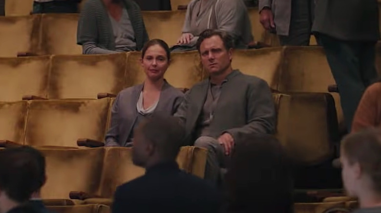 Tris' parents sit alone after the Choosing Ceremony