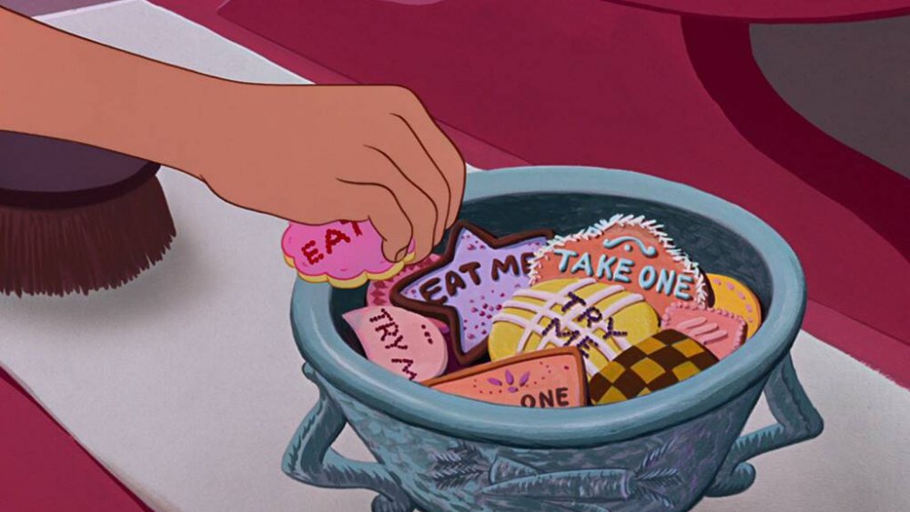 Alice taking an "EAT ME" cookie, from Disney's Alice in Wonderland