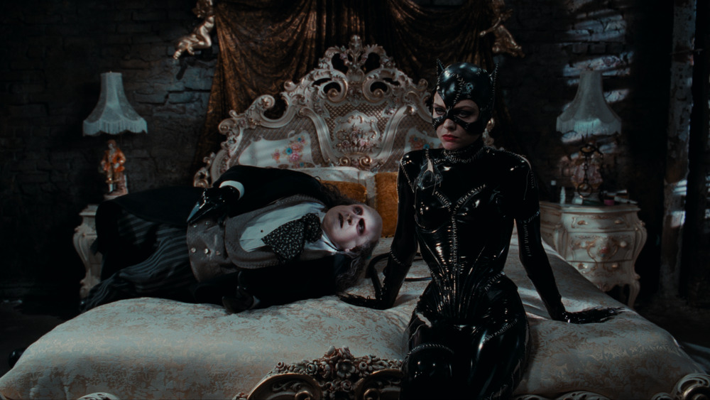 Catwoman and Penguin on bed