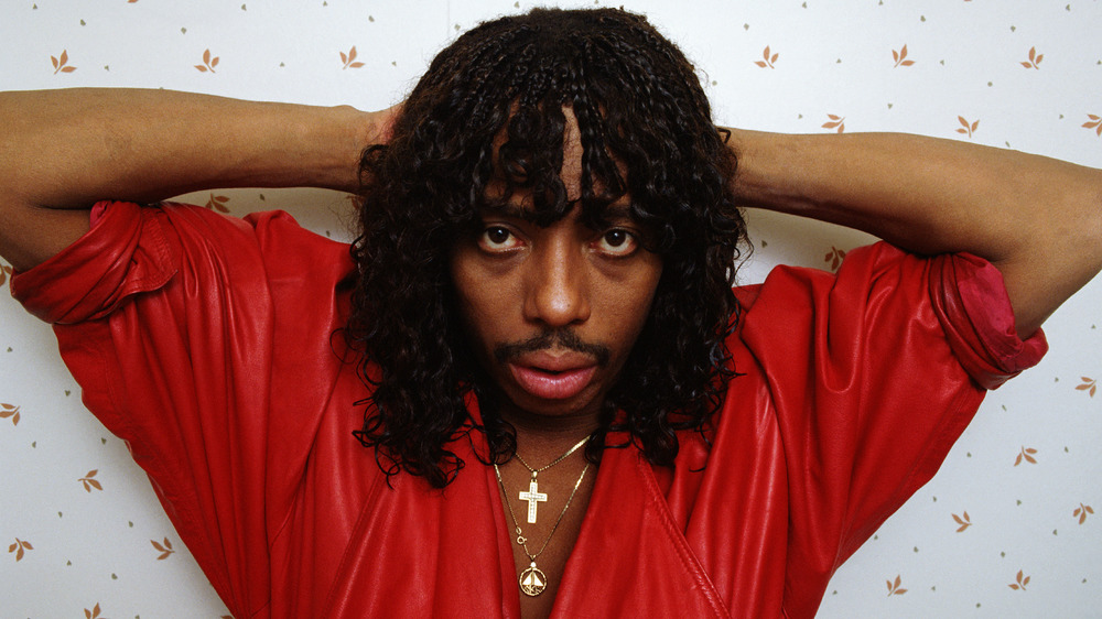 Rick James in red shirt