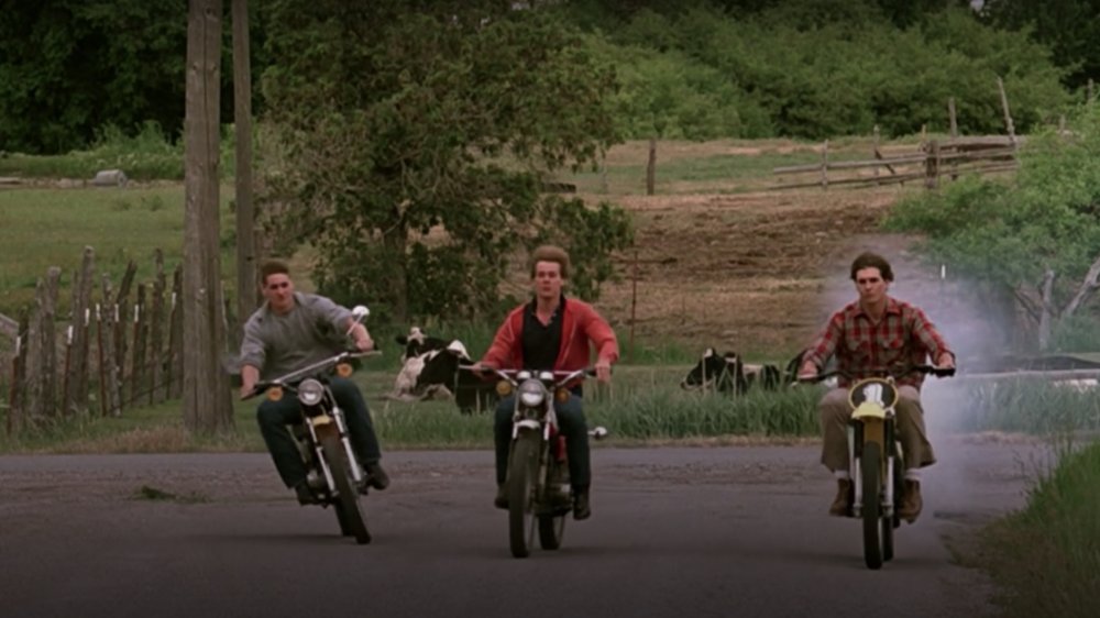 Chris Penn as Willard Hewitt, Kevin Bacon as Ren McCormack, and John Laughlin as Woody in Footloose