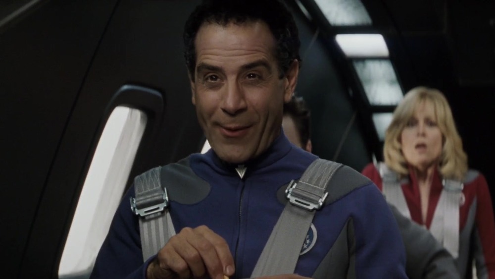 Fred (Tony Shalhoub) enjoying the flight down to the alien planet.