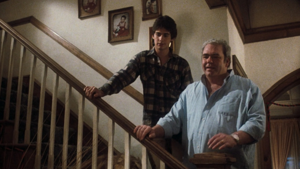 Zach Galligan as ﻿Billy Peltzer and Hoyt Axton as Rand Peltzer in Gremlins