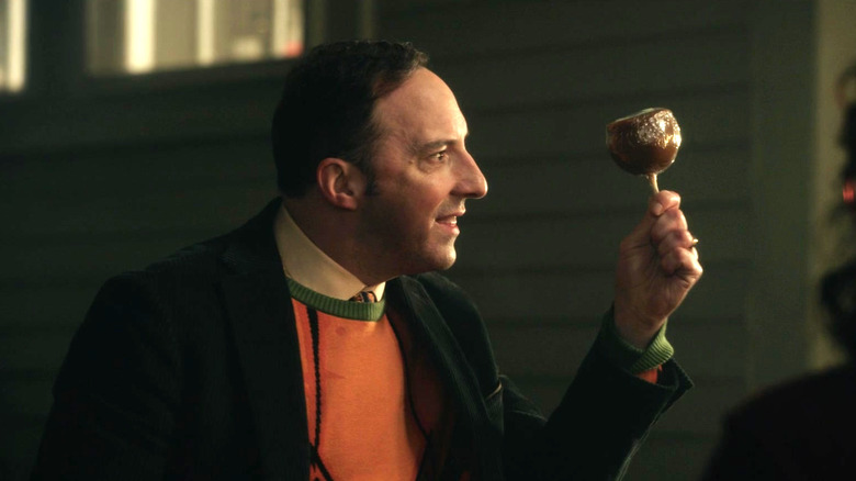 Tony Hale holds up candy apple