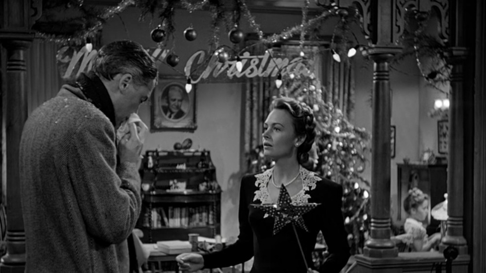 Jimmy Stewart as George Bailey and Donna Reed as Mary Bailey in It's a Wonderful Life