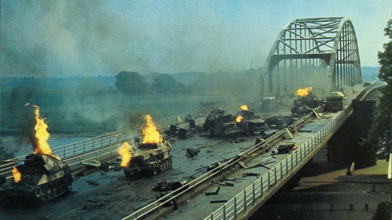 Bridge covered in burning tanks