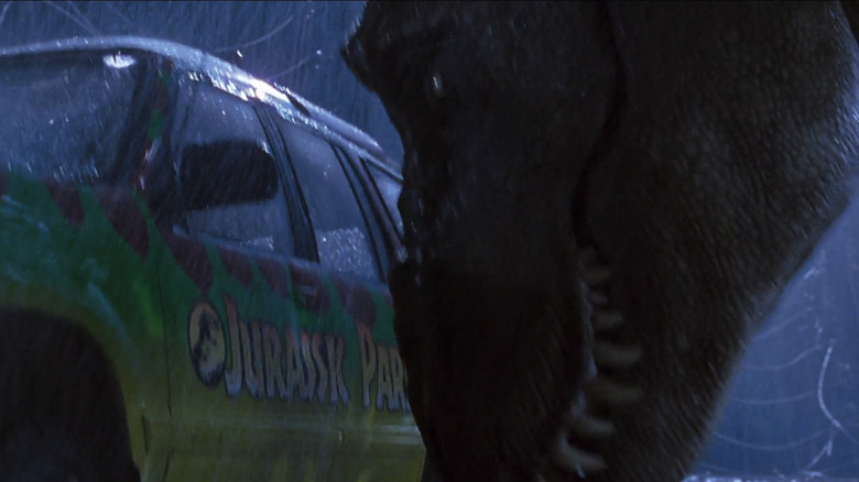 Tyrannosaurus tipping car