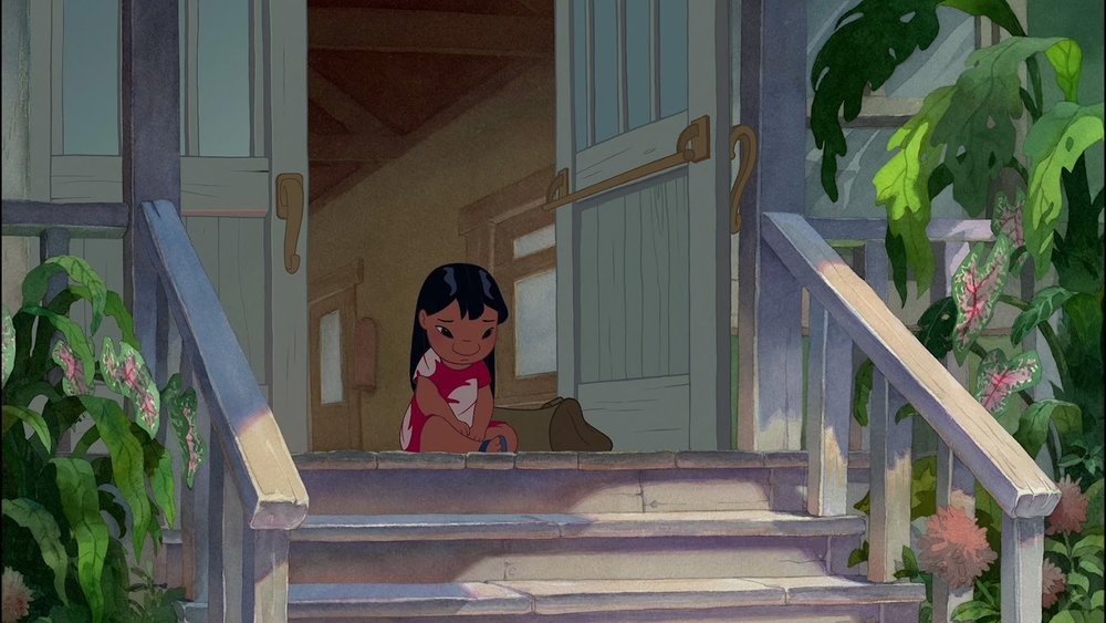 Lilo kneeling in doorway