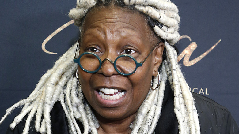 Whoopi Goldberg in close-up at a red carpet event