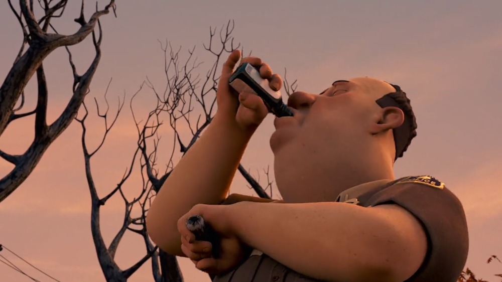 A police officer takes a swig of cough syrup in Monster House