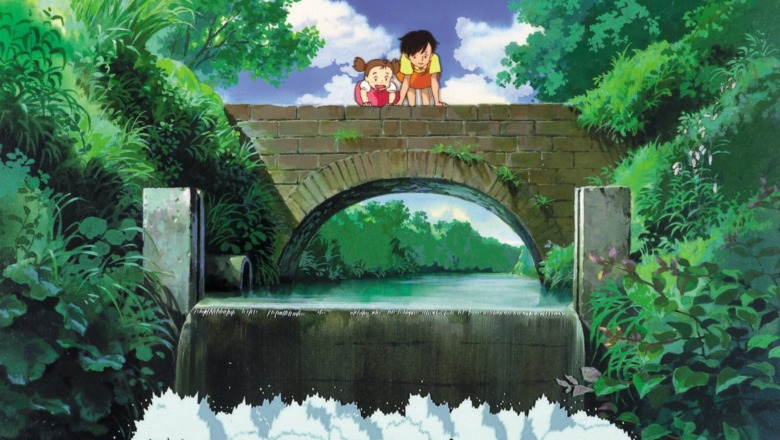 Mei and Satsuki leaning over bridge