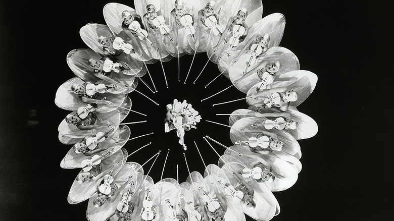 Dancers forming kaleidoscope shape