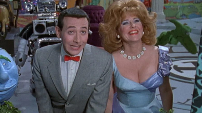 Pee-Wee and Yvonne look through window