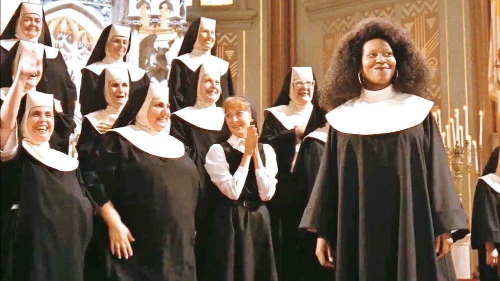 Deloris smiles with nuns