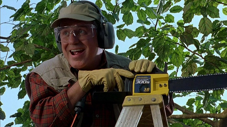 Phil Hartman smiling chainsaw