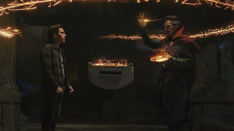 Peter Parker watches as Dr. Strange casts a spell