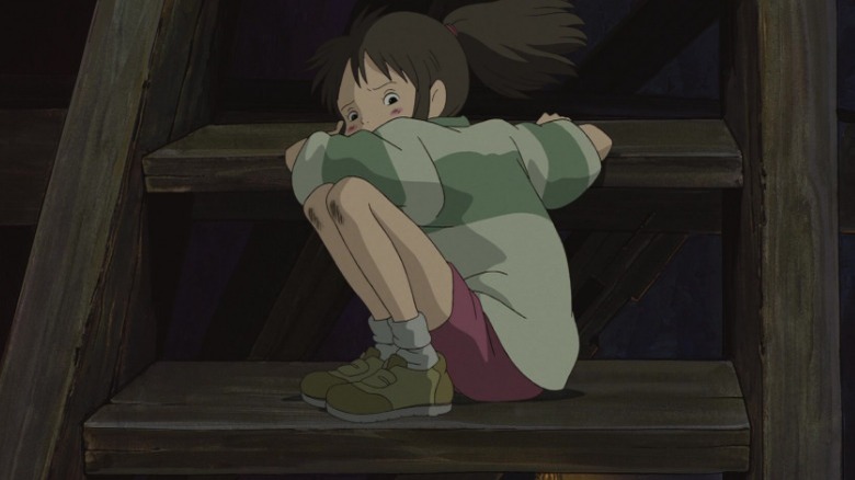 Chihiro inching down stairs