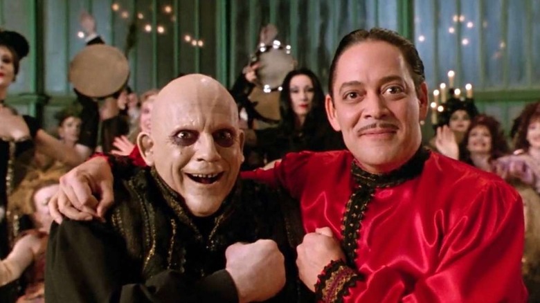 Gomez with arm around Fester