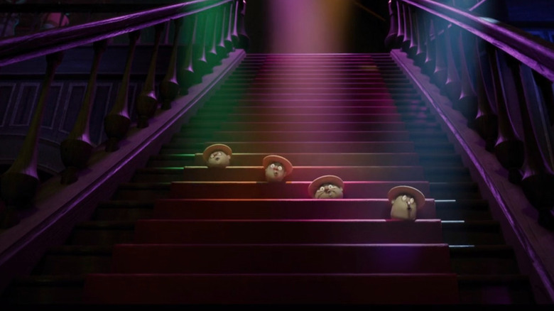 Heads performing on stairs