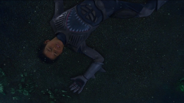 Sharkboy lays unconscious at the bottom of a river