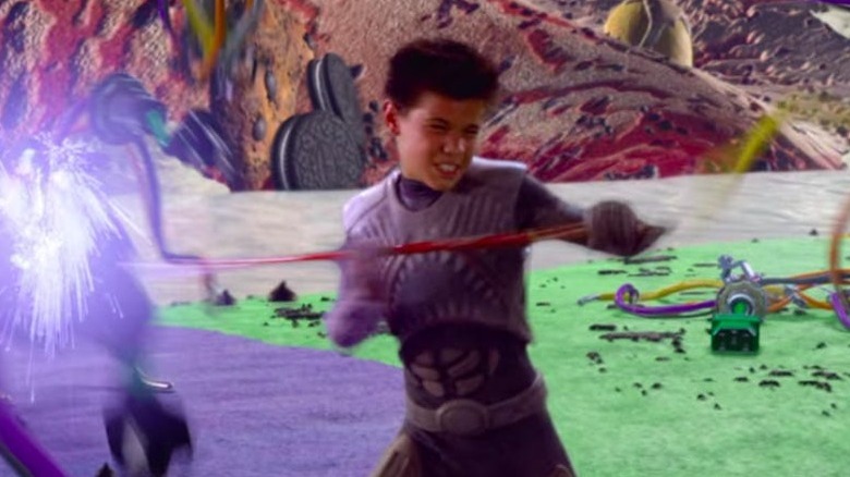 Sharkboy fights off a pack of cord monsters