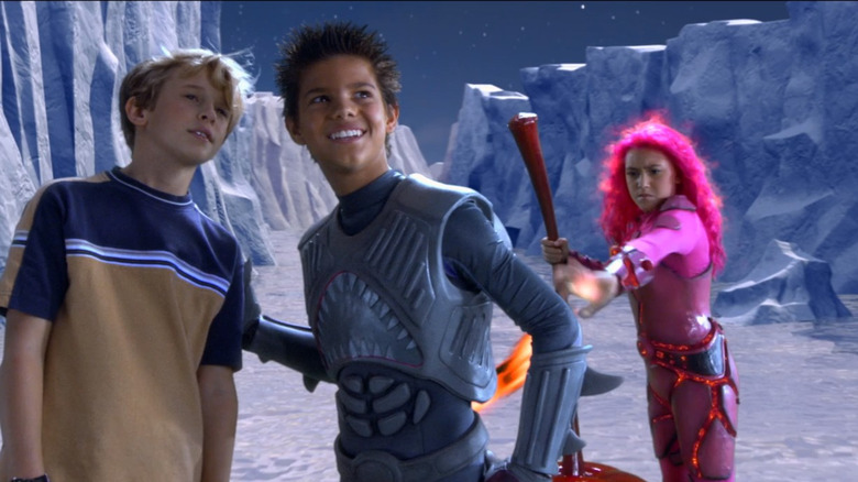 Max talks to Sharkboy as an angry Lavagirl zaps him with lava