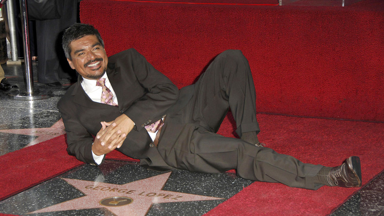 George Lopez poses with his Hollywood Walk of Fame star