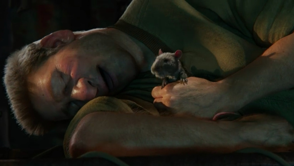 Man sleeping with rat