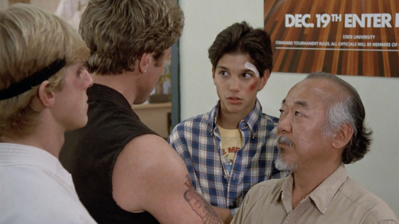 Johnny, John, Daniel, and Mr. Miyagi talking