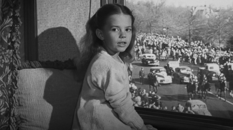 Susan Walker watches parade through window