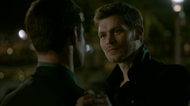 Klaus holds Elijah's shoulder