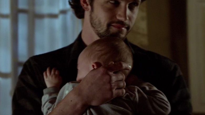 Jackson carrying infant Hope