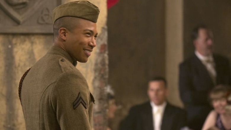 Marcel smiles in uniform