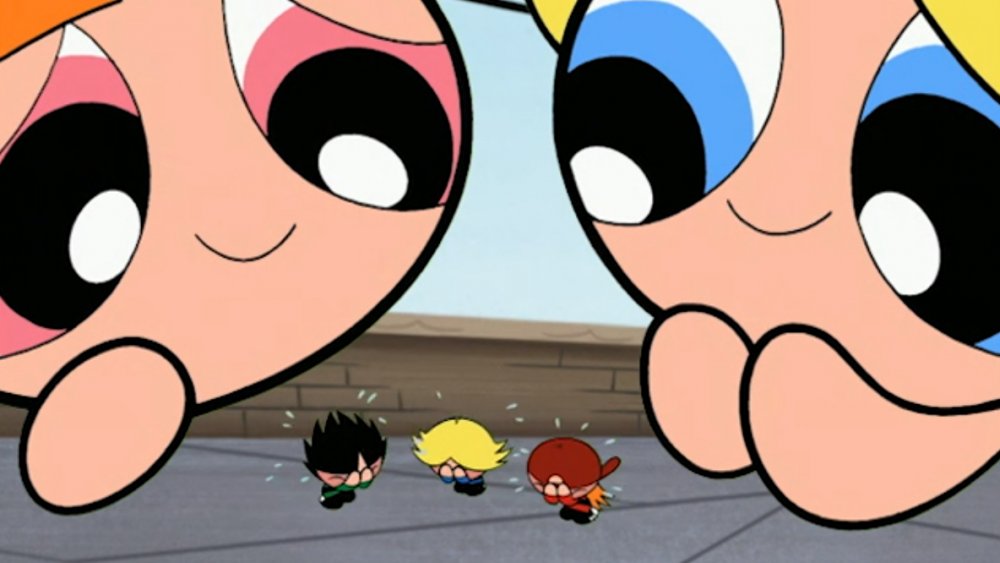 Blossom and Bubbles looming over shrunk Boomer, Brick, and Butch in "Powerpuff Girls"