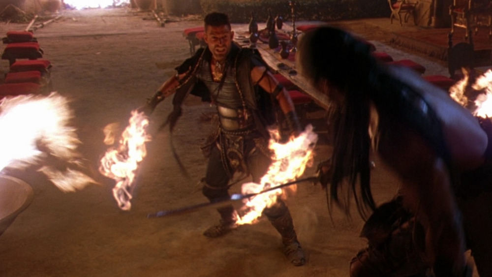 Steven Brand as Memnon, with his flaming swords in The Scorpion King