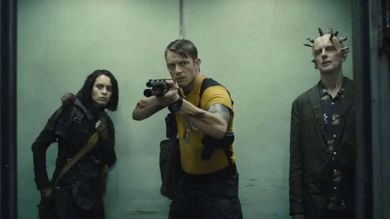 Peter Capaldi, Joel Kinnaman and Daniela Melchior in "The Suicide Squad"