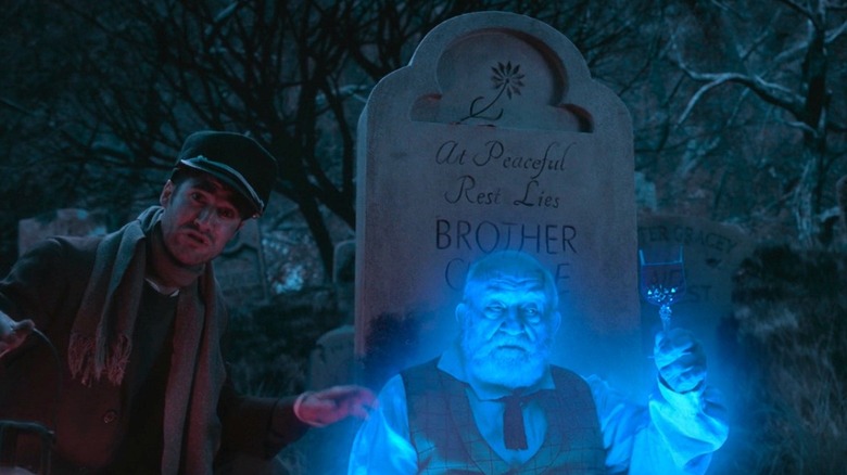 Darren Criss and Ed Asner in the graveyard in Muppets Haunted Mansion