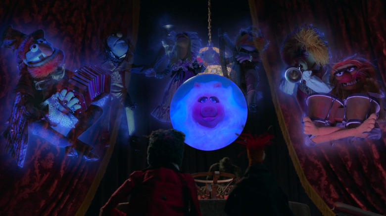 Miss Piggy as Madame Leota and the Electric Mayhem as the ghostly band in Muppets Haunted Mansion