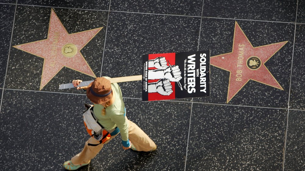 A person carrying a placard supporting the 2007-2008 Writers Guild of America strike