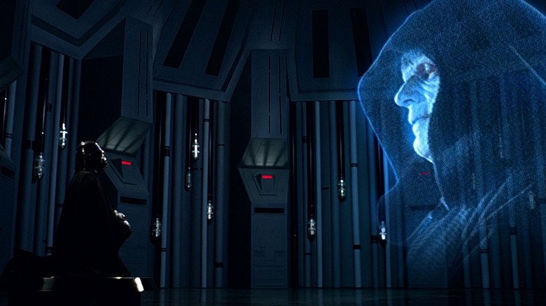 Darth Vader looks at holograph of Emperor