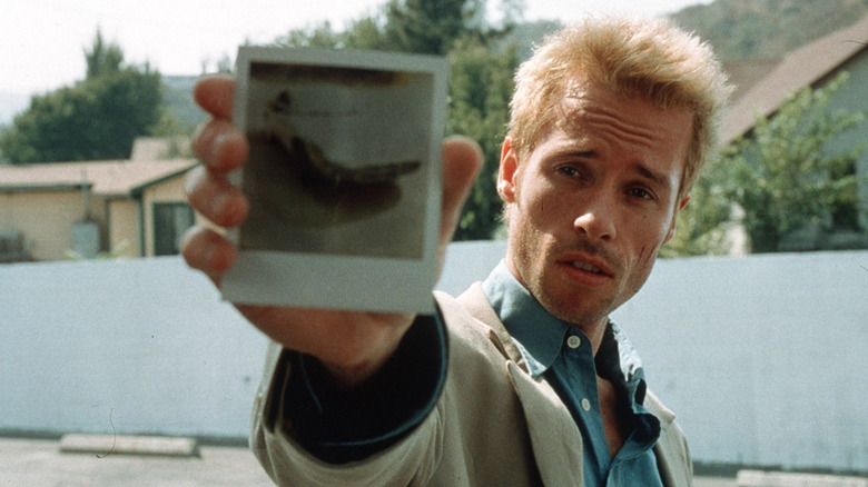 Guy Pearce holding photo