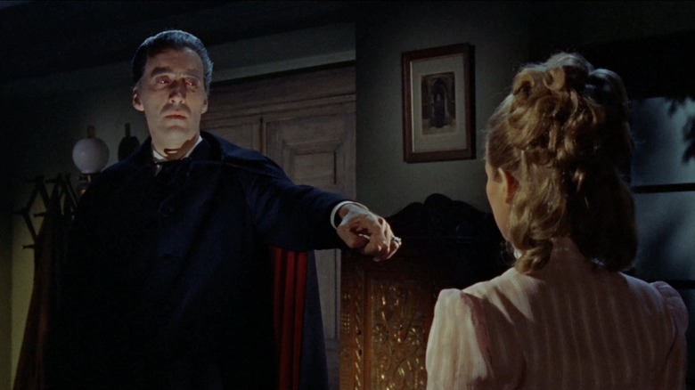 Dracula pointing at woman Dracula: Prince of Darkness