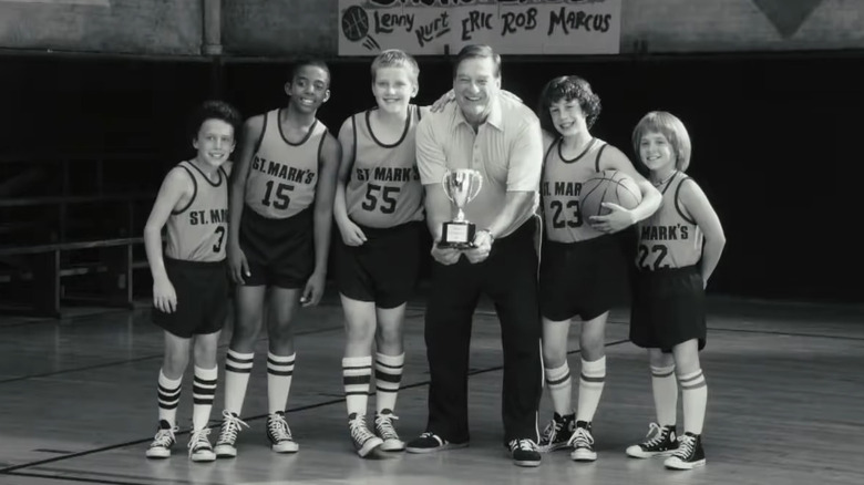 Boys pose with basketball coach