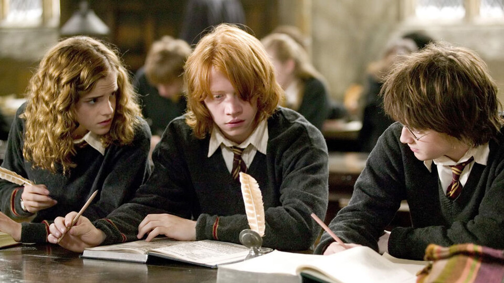 Harry, Ron, and Hermione studying